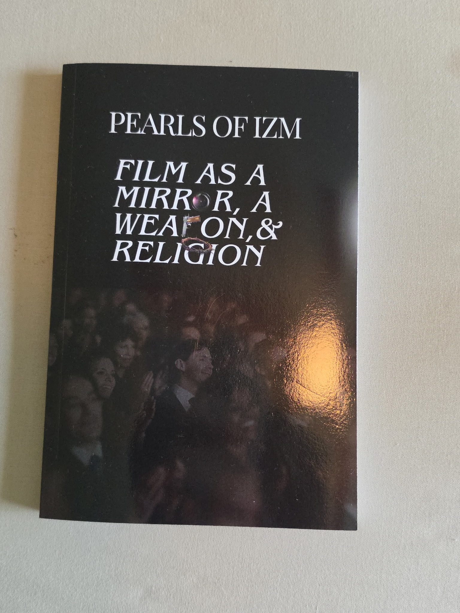 Pearls of IZM: Film as a Mirror, a Weapon, & Religion — photograph of the actual book